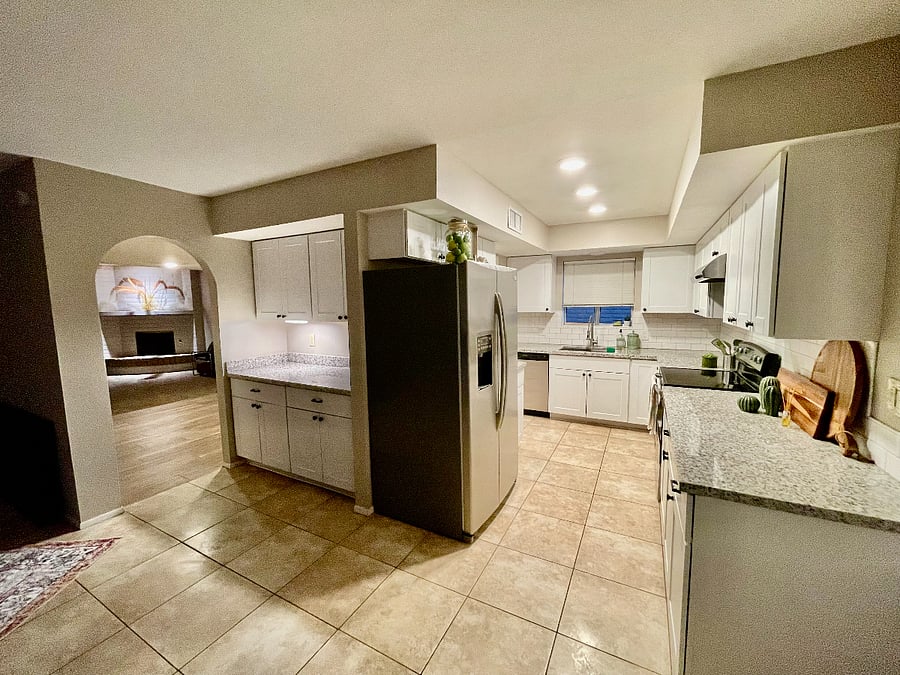 from backdoor - walk into the updated kitchen with extended cabinetry & storage