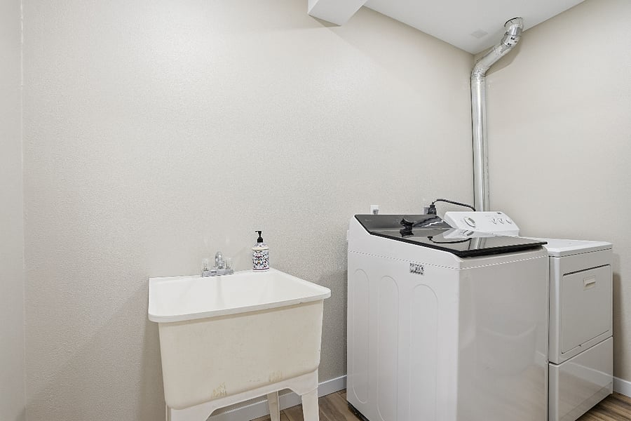 The laundry room feature a new extra capacity washing machine and brand new dryer that make laundry a breeze.