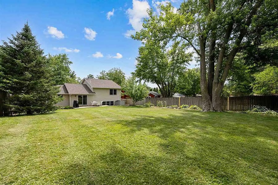 The large backyard is an amazing space for hanging out, hosting tailgates or gardening.