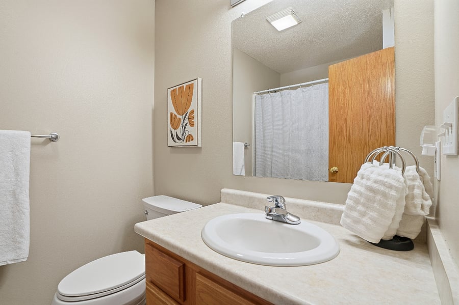 The two guest bedrooms share a clean and well appointed bathroom with plenty of storage.