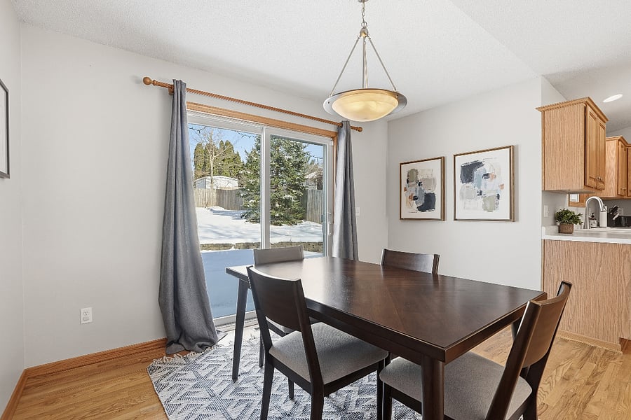 Cozy dining area with beautiful views of the backyard space and new furniture.