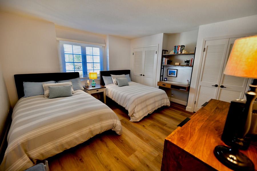 2nd Bedroom with 2 full size beds and a small desk area.
