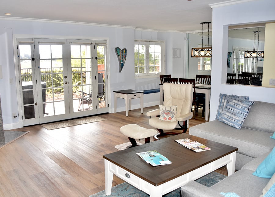 Living area with view over patio and Lagoon.