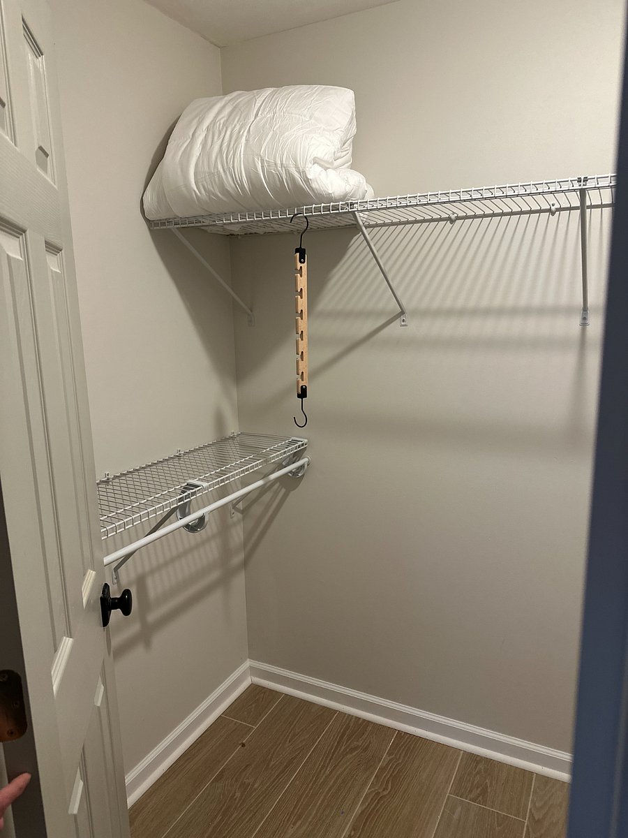 walk-in closet of bedroom. 