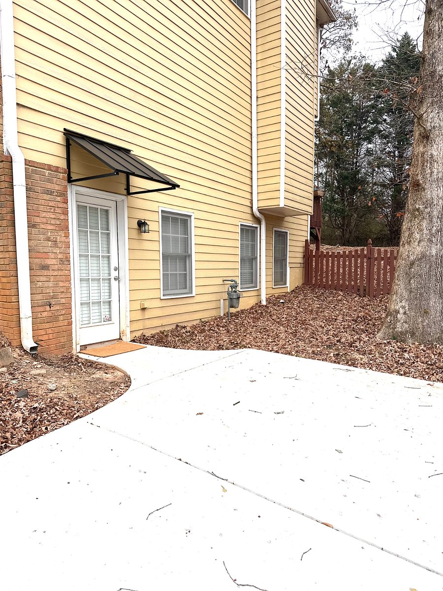 private driveway with parking and private covered entrance. 