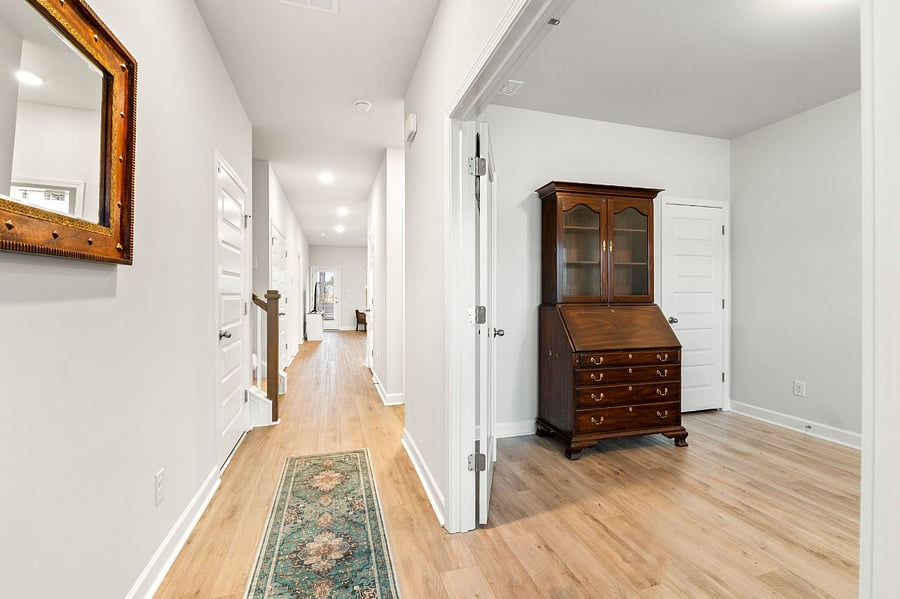 Front hallway and entry.  Double doors lead to sitting room/3rd bedroom.