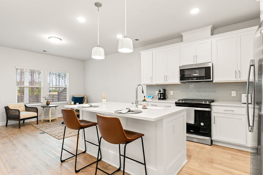 Kitchen and great room.  Center island with farmhouse sink.