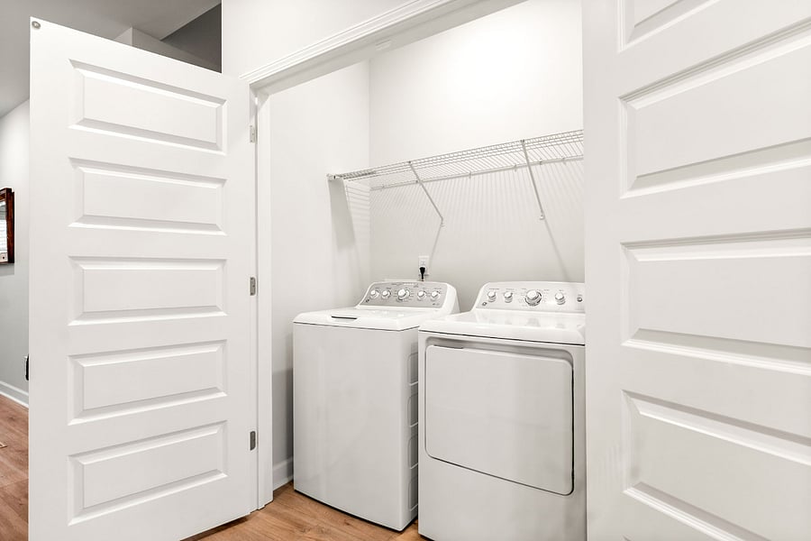 Washer and dryer closet located on the main floor near the master bedroom.