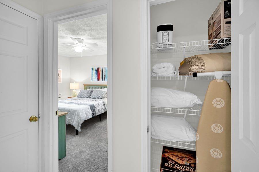 Full-size ironing board, linens included. Good storage!