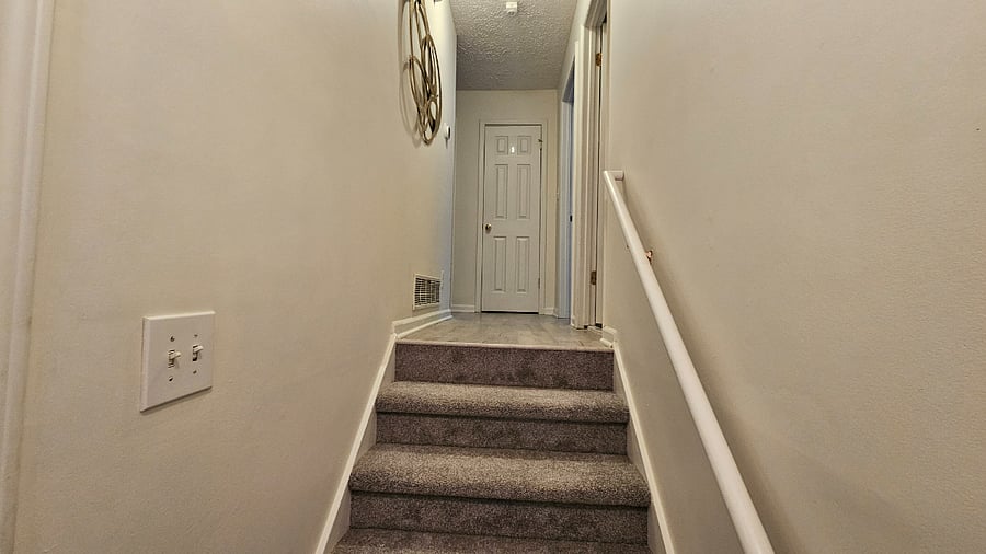 Five steps from  living area to bedrooms and bathrooms