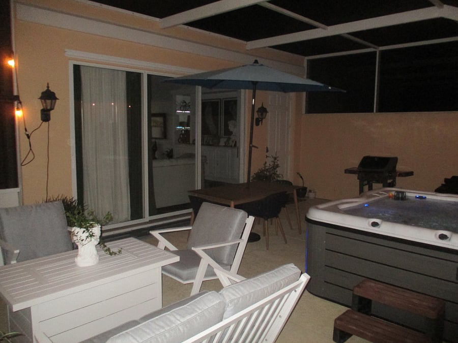 rear lanai with hot tub and grill