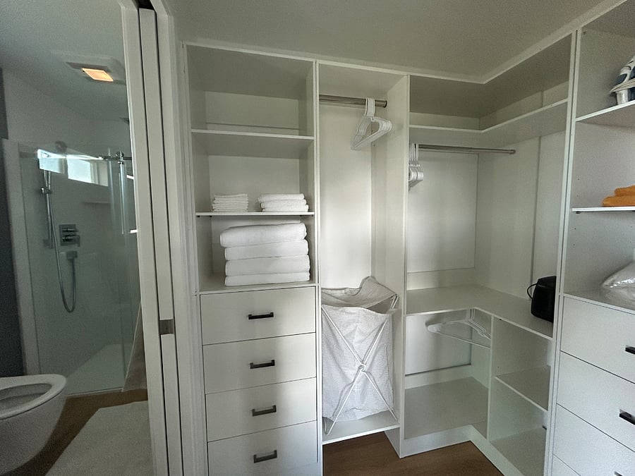 Walk in closet/dressing room between bedroom and bathroom. Barn door closure for privacy from the bedroom.