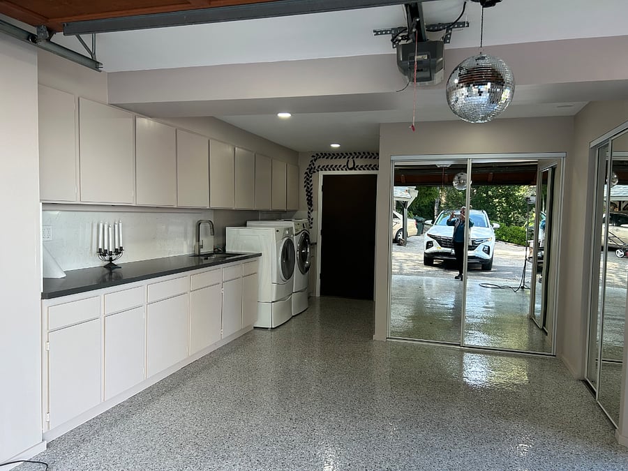 Shared use garage for laundry, mail, projects, social and exercise. Owner parks car here but also enjoys shared use of the amenity with occupants.