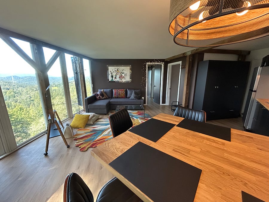 View across living space from island dining area to bedroom.