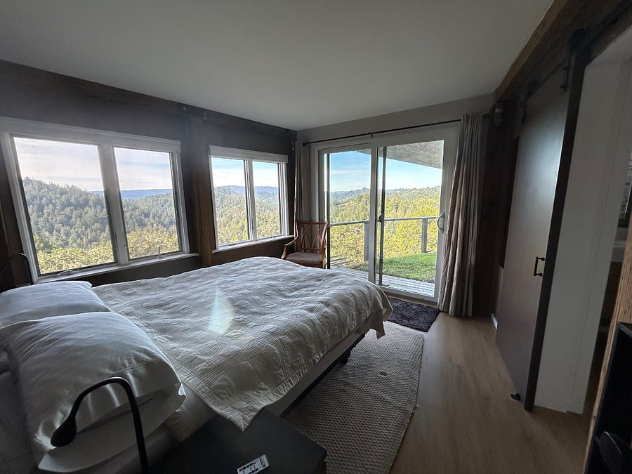 Bedroom has expansive view as well. Queen size McCroskey mattress with luxury cotton sheets and duvet cover.