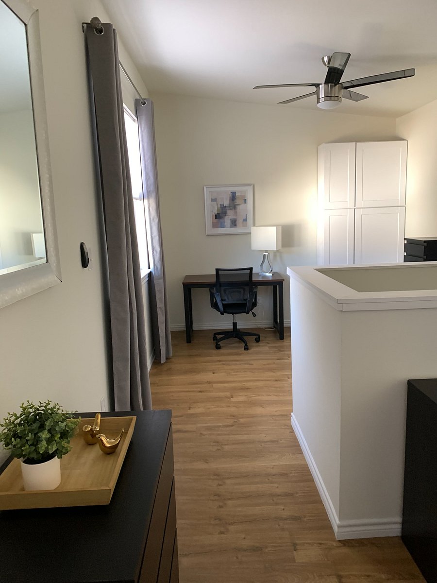 Loft area with desk and linen cabinets 