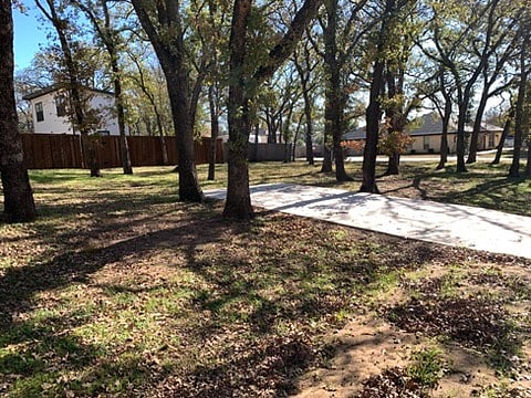 Apartment/casita from front side yard showing gate and part of driveway.