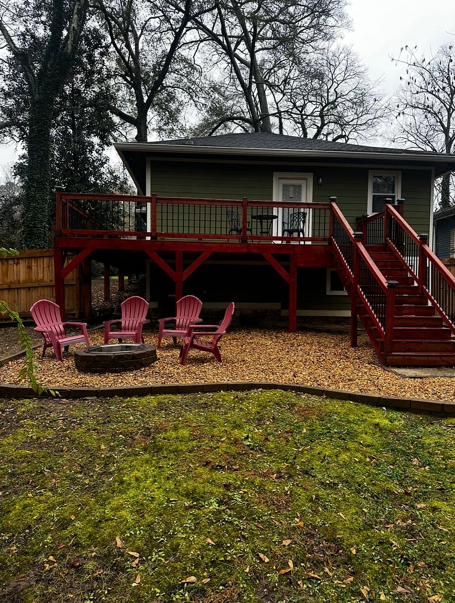 partially fenced-in backyard with fire pit