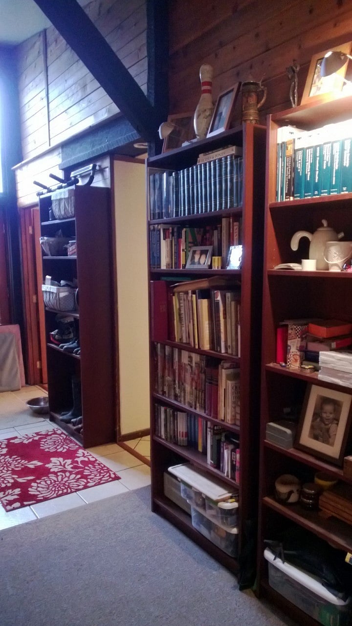 These bookshelves line the opposite side of the living room. You can keep any or all of them or  I can move them to storage. (They are empty now.)