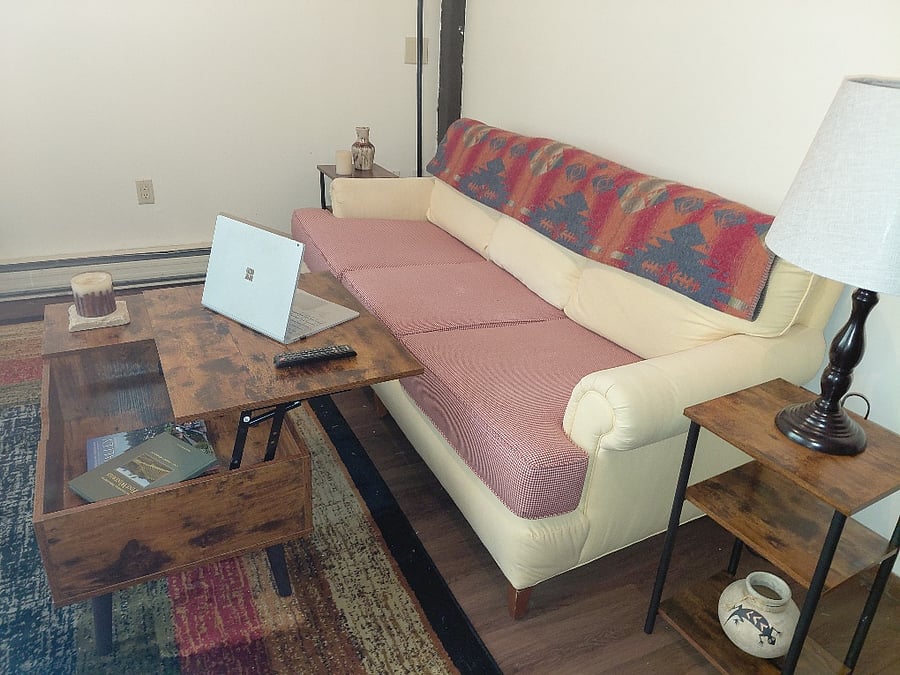 Living room. Coffee table opens up for a work or gaming space