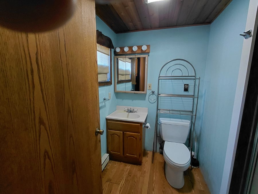 Shower stall on right, Towels, linens stored behind door. Floor mats coming!
