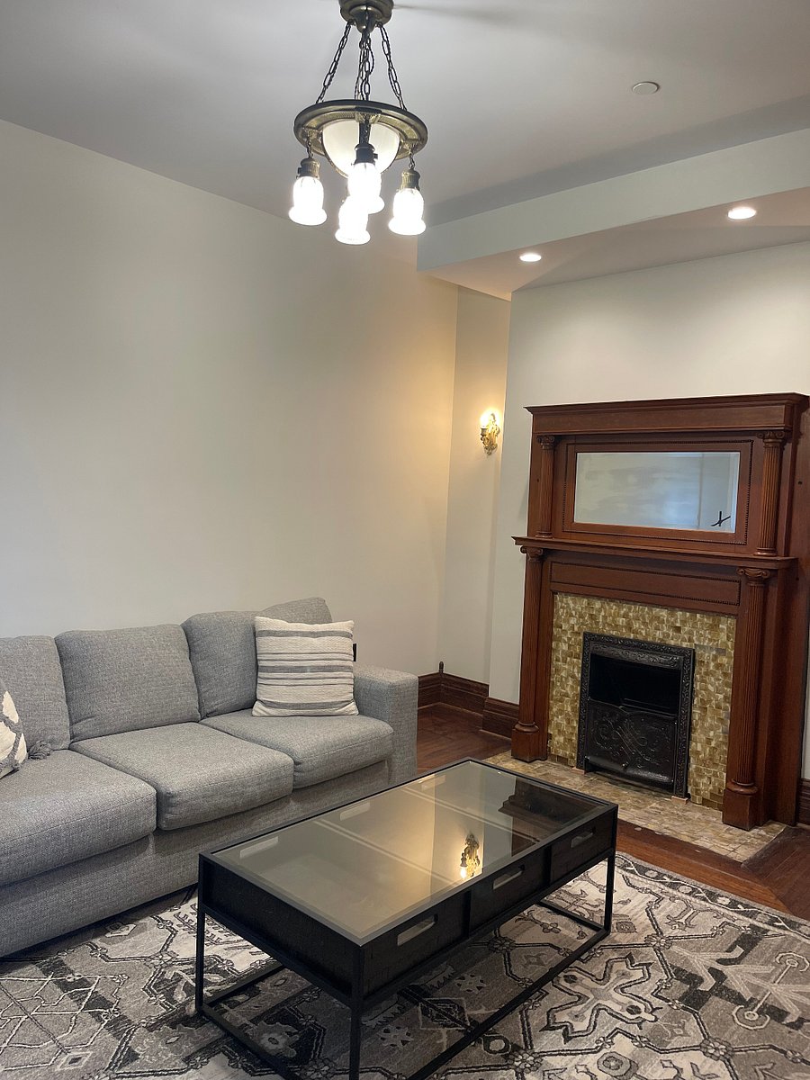 Refinished fireplace adds visible warmth.