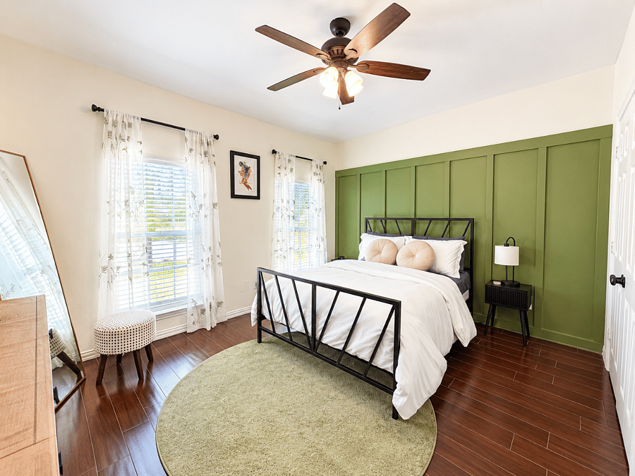 Relaxing full size bedroom with a soft, comfy feel and a TV.