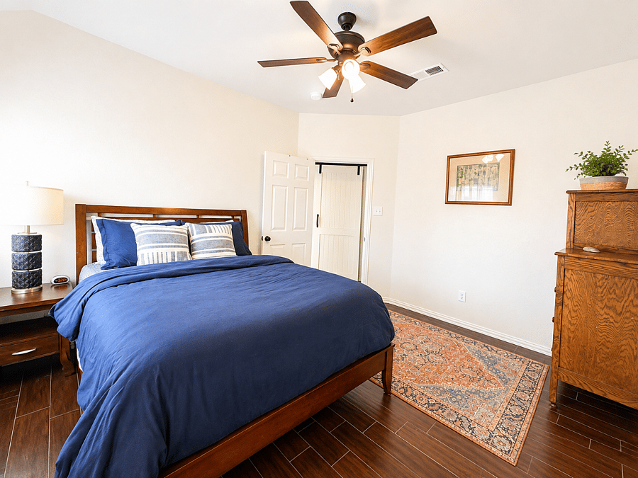 Comfortable queen bedroom with a peaceful setup.