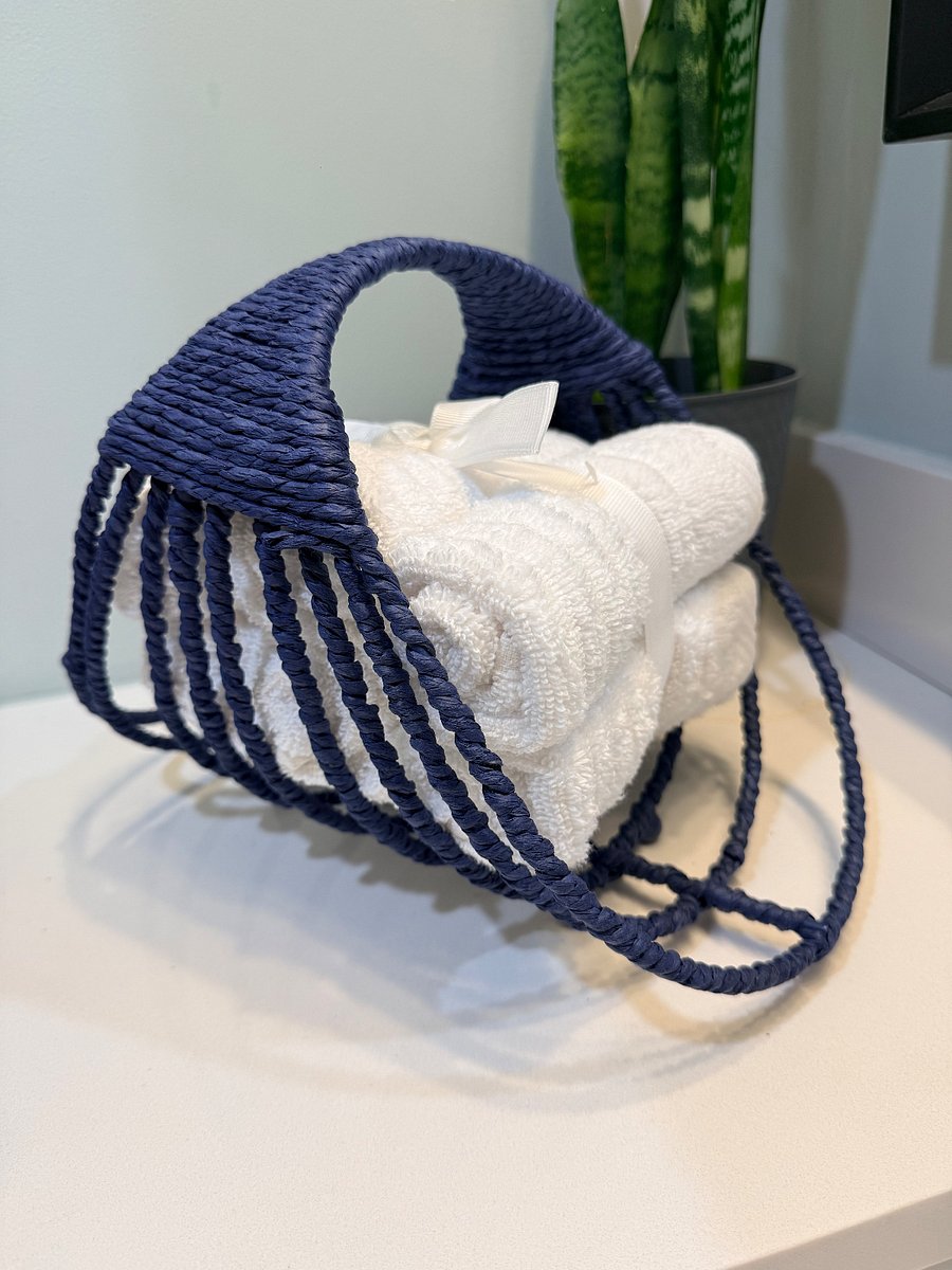 White Facial and bath clothes in bathroom on the first floor. 