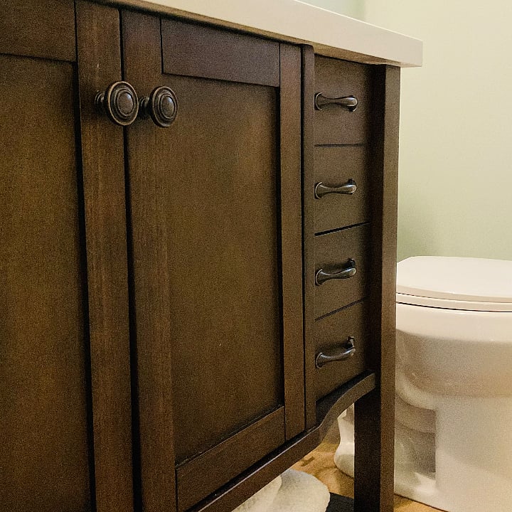 Bathroom cabinet with new fixture and tile.  new toilet with dual flush. First aid kit, extra toothpaste and mouthwash in case you forget yours.  Extra towels in the built in cabinet. 
