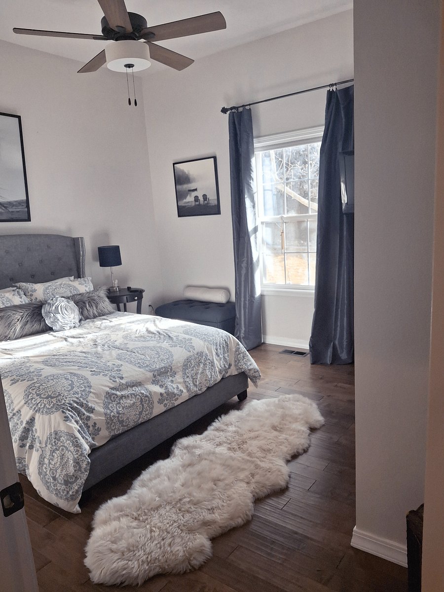 Comfortable bedroom w room darkening silk drapes, TV, double closet, luxury double pelt rug
