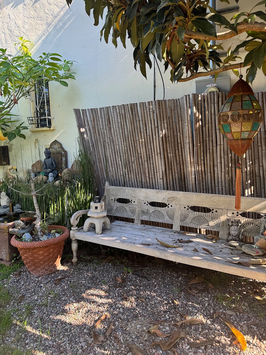 metitation bench next to water feature