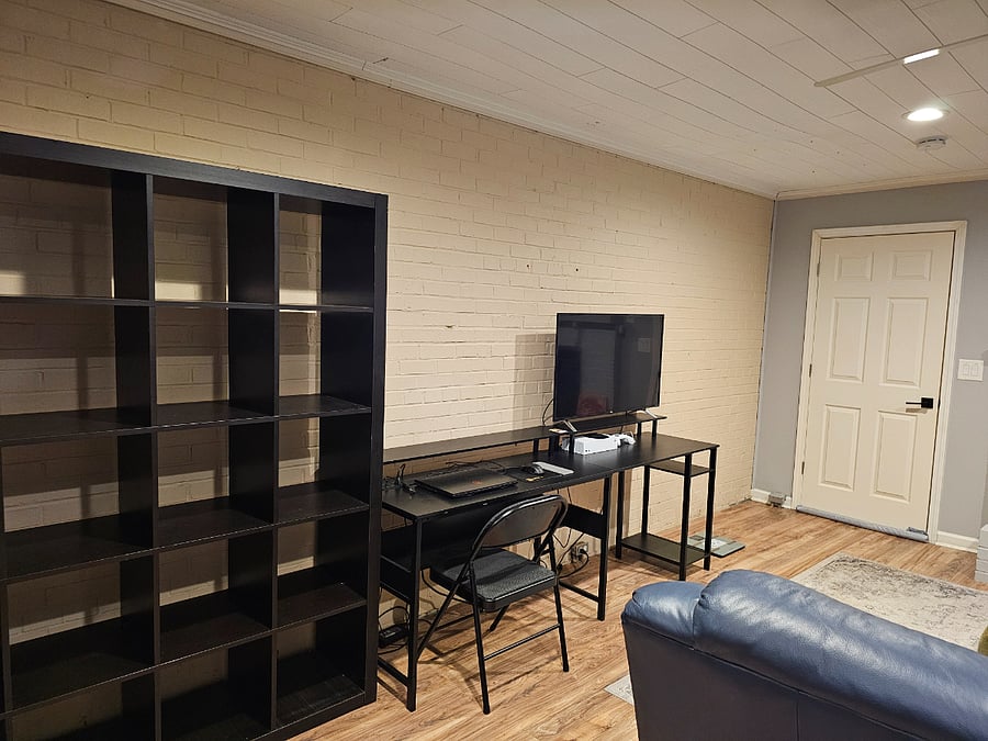 Living room with TV, Desk and Bookcase