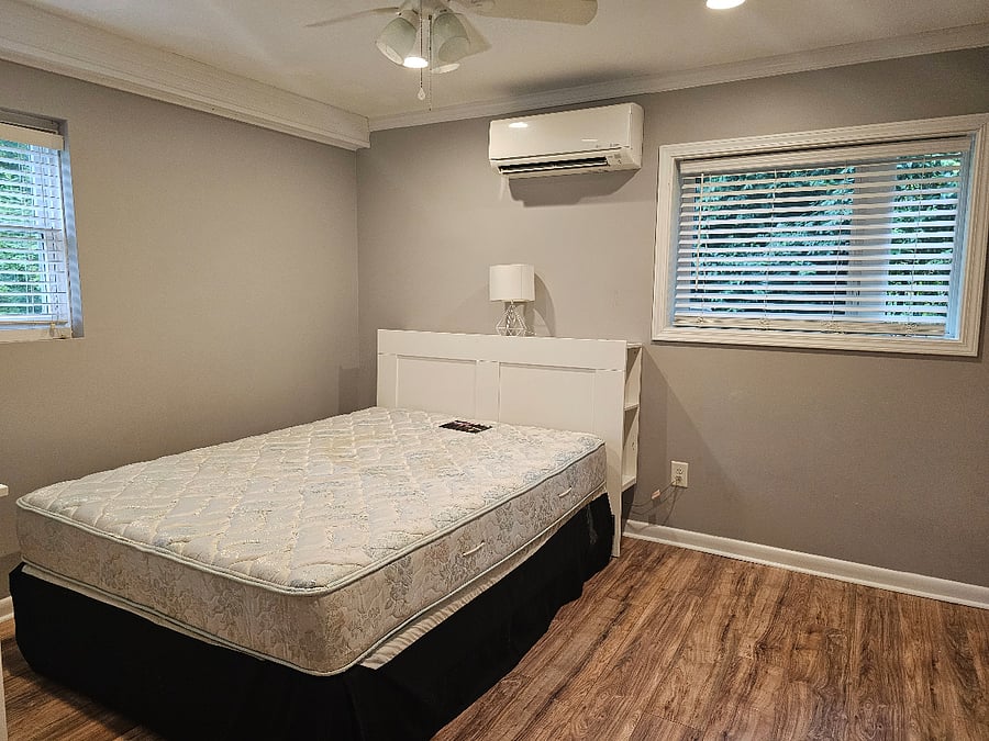 Bedroom with Queen bed. Linens available upon request. Ceiling fan and mini-split for personal control of AC / Heat.