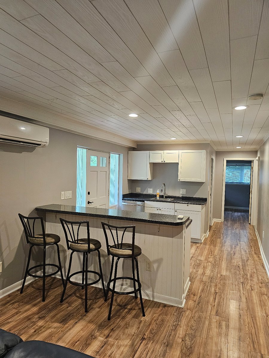 Kitchen with dishwasher, sink, garbage disposal, and small appliances. Dishware and all utensils provided.