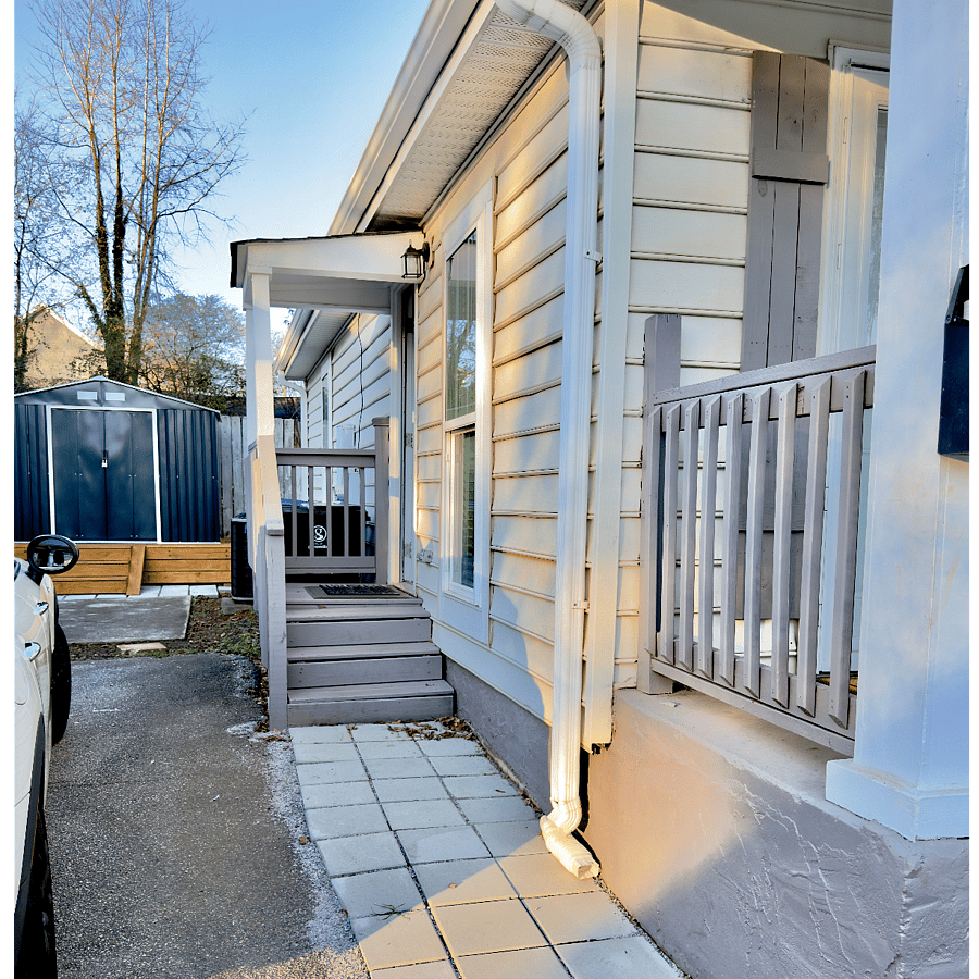 Side Entrance: Private entry directly beside the parking spaces.