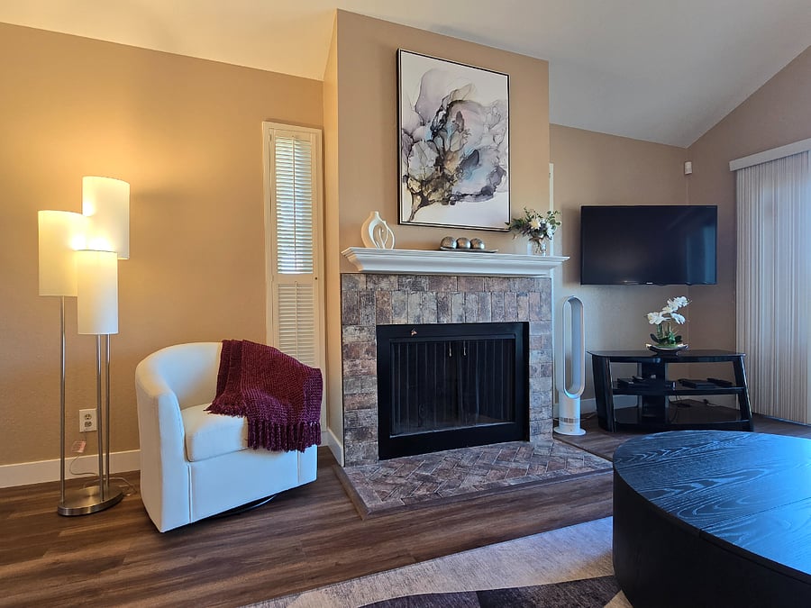 Fireplace has remote controlled flameless candles to set up a cozy ambiance.