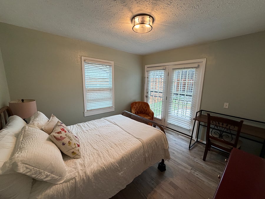 Second Bedroom has Full Sized Bed, Dresser, Desk (can be moved around the house or folded flat), and Door to Backyard (used as private entrance or can be locked) - One Closet