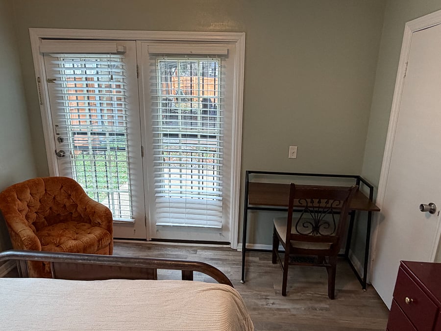 Second Bedroom has Full Sized Bed, Dresser, Desk (can be moved around the house or folded flat), and Door to Backyard (used as private entrance or can be locked) - One Closet