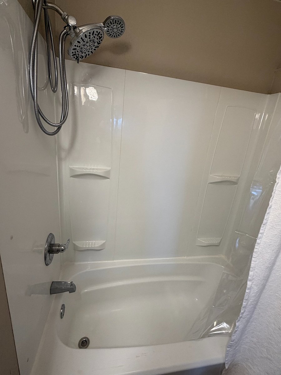 Bathroom with Vanity Mirror, Table for Bathroom Items (Linen closet in hall), Full Tub, & Removable Shower Head - Great water pressure!