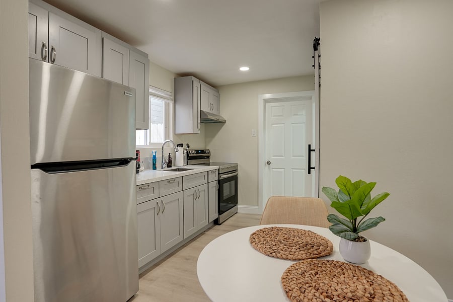 Unit B Studio Kitchenette with stove, fridge, microwave and drop coffee