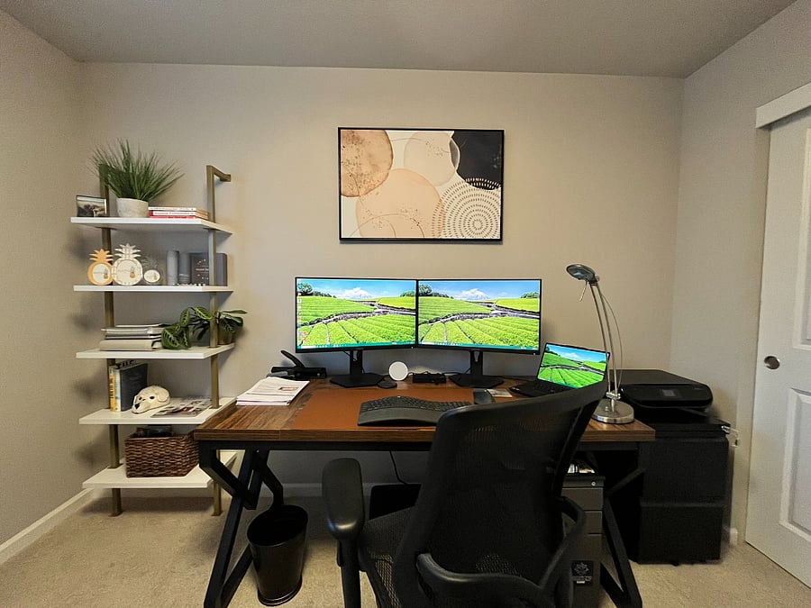 Shared office space with desktop station for you to plug into with a laptop. 