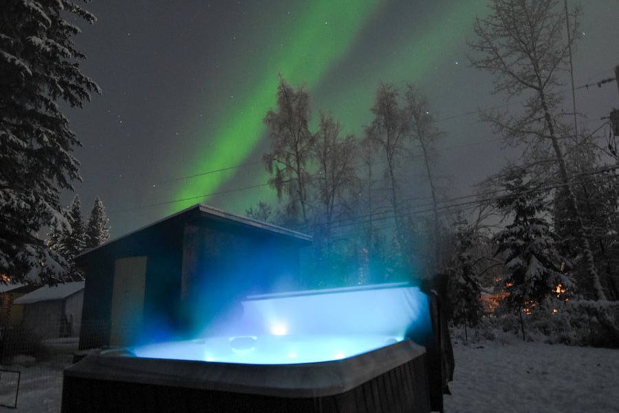 Unwind in the private 4-person hot tub with three seats and a lounge chair, and enjoy a great view of the aurora on clear nights. Adjustable two-zone jets and optional color lights set the mood.