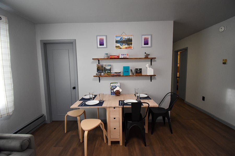 Enjoy a meal or game night at the expandable dining table, stocked with puzzles, board games, and books.
