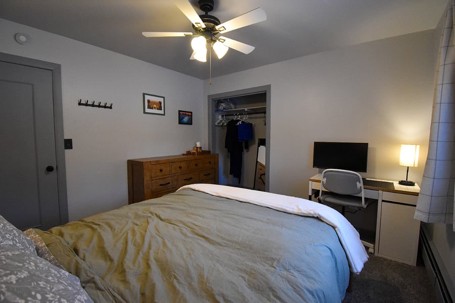 Rest easy on a comfy queen bed with dimmable bedside lamps, blackout curtains, and a full closet. A desk with a monitor and HDMI cables makes it easy to work or study during your stay.