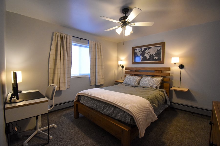 Rest easy on a comfy queen bed with dimmable bedside lamps, blackout curtains, and a full closet. A desk with a monitor and HDMI cables makes it easy to work or study during your stay.