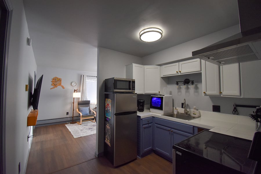 Open kitchen with a clear view into the living areaperfect for staying connected while you cook. The TV swivels toward the kitchen so you can catch a show or movie while prepping meals.
