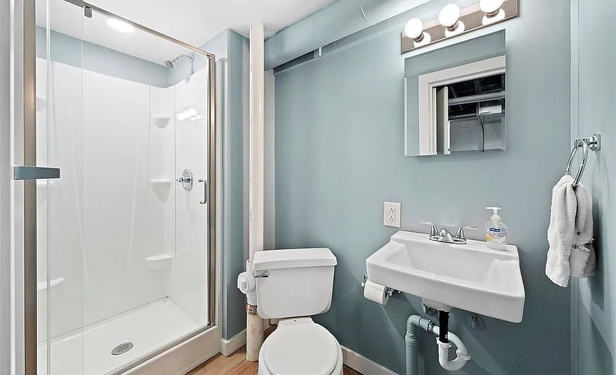 Bathroom 2 in basement adjacent to laundry