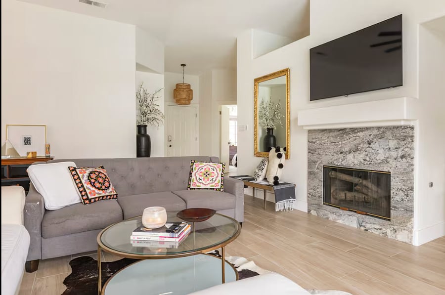 The couches shown have been upgraded to a spacious, modern sectional plus a large leather chair for extra comfort