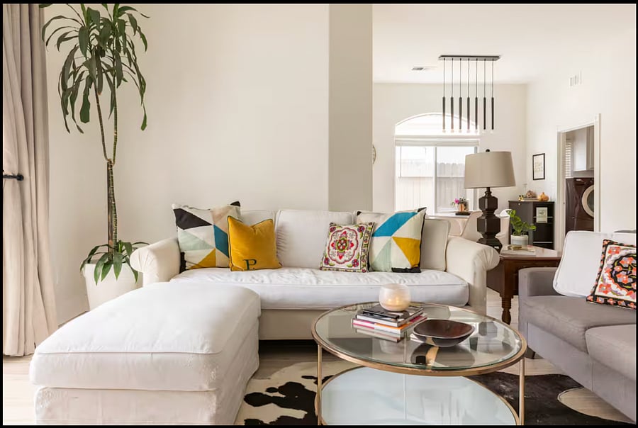 The couches shown have been upgraded to a spacious, modern sectional plus a large leather chair for extra comfort